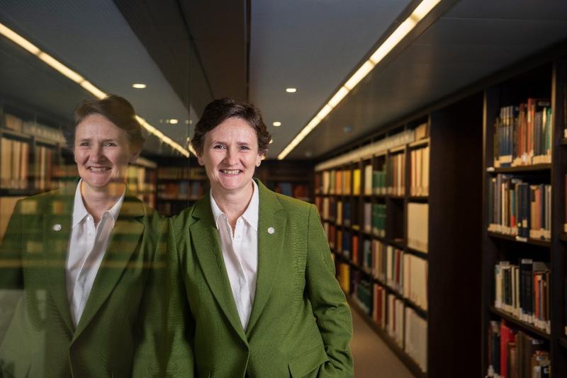 Vice Chancellor Irene Tracey in a library