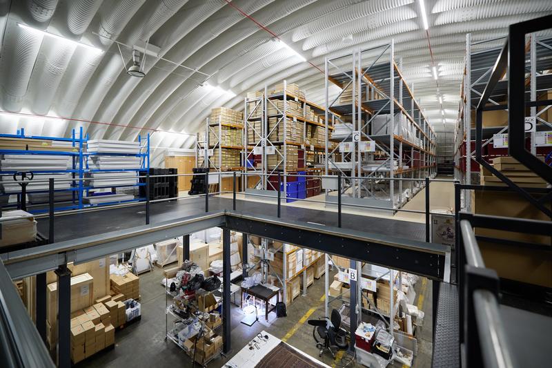 A wide-view of a two-story storage facility full of packed boxes