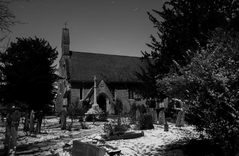 a snow covered churchyard