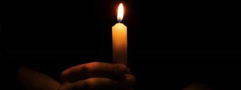 Candle and a hand