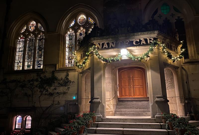 Christmas decor outside a building at night