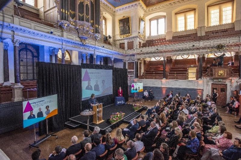 A wide-view shot of the Vice-Chancellor's Awards 2024 in the Sheldonian Theatre, showing the stage and audience