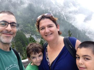 Vered Balan with her husband and two sons with mountains in the background