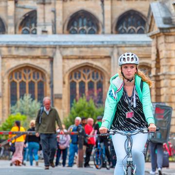 girl cyclist in Oxford with helmet on 