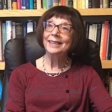 Susan Doran, Professor of Early Modern British History Susan Doran sat in her office with a bookshelf in the background