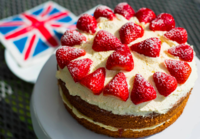 Victoria sponge cake covered in strawberries